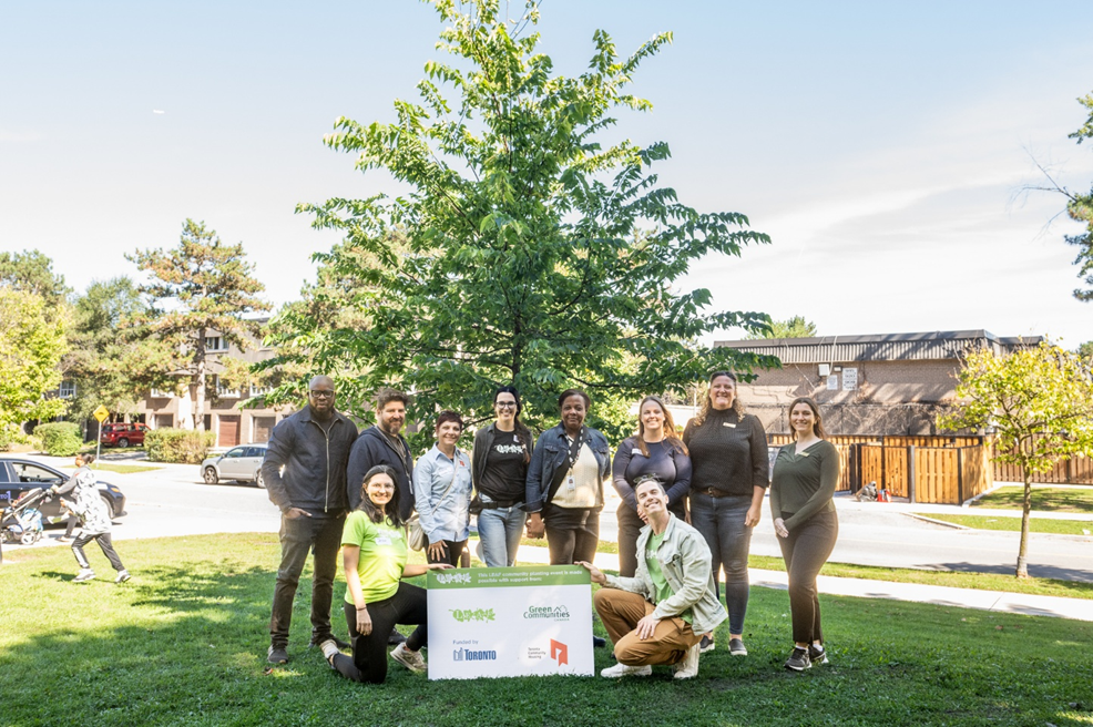 tenants and staff member from TCHC, City of Toronto, and LEAF posing outside under a tree