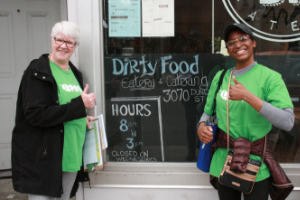 Volunteers posing beside store front(© 2018 David Shilman)