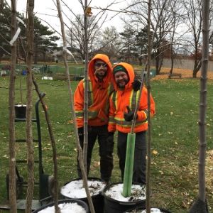 Tree planters posing by trees(© 2018 Janet McKay / LEAF)