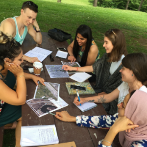 © 2018 Natalie Secen Group looking at maps on a picnic table(© 2018 Natalie Secen)