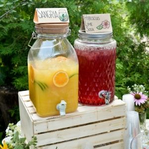 Two jugs on a rustic table display, one serving sangria and the other hibiscus lime soda(© 2019 Alan Li / LEAF)