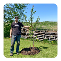 LEAF staff posing with newly planted tree(© 2023 Jon Curtis / LEAF)