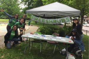 LEAF staff and volunteers posing by the free native shrub giveaway table